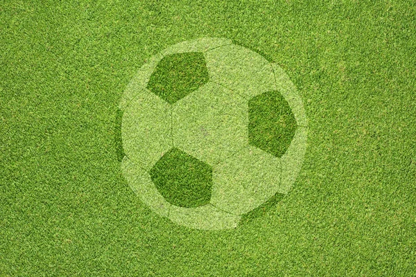 緑の草のテクスチャと背景にサッカー — ストック写真
