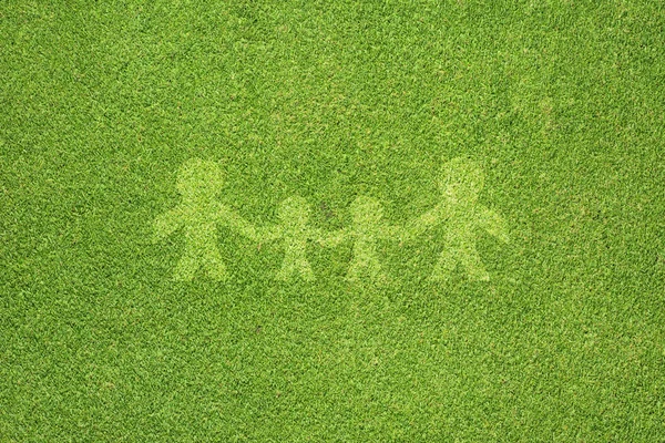 Family on green grass texture and background — Stock Photo, Image