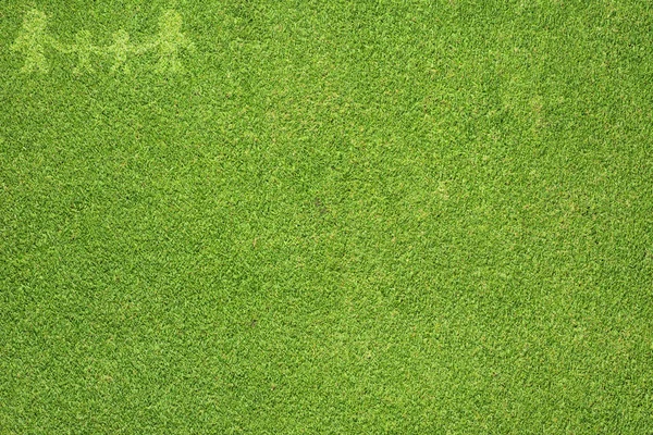 Сім'я на зеленій траві текстури і фон — стокове фото