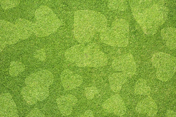 Srdce na zelené trávě, textury pozadí — Stock fotografie