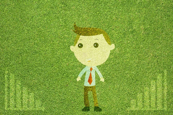 Business man on green grass texture and background — Stock fotografie