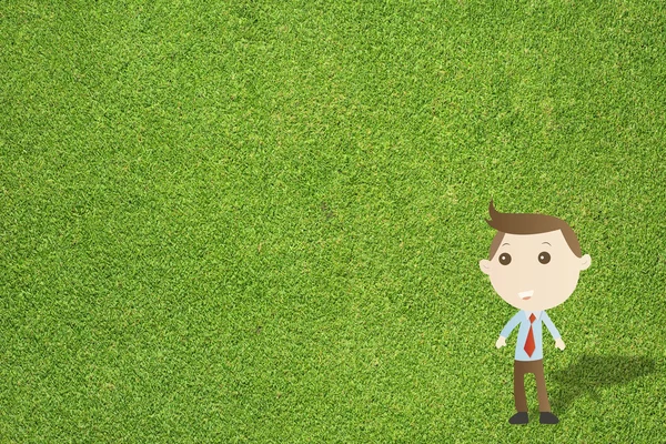 Business man on green grass texture and background — Stock Photo, Image
