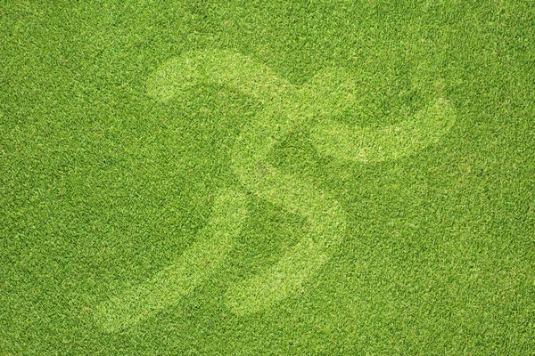 緑の草のテクスチャと背景で実行されているスポーツ — ストック写真