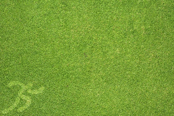 Спорт, що працює на зеленій текстурі трави та фоні — стокове фото