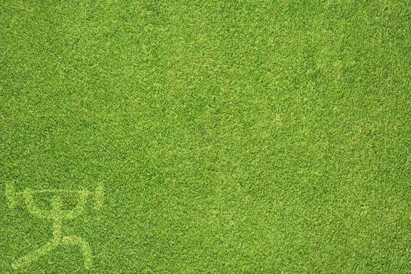 Sport gewicht op groen gras textuur en achtergrond Stockafbeelding