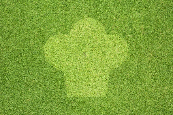 Szef kuchni ikona na zielonej trawie tekstury i tła — Zdjęcie stockowe