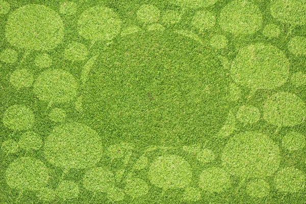Ícone de comentário na textura de grama verde e fundo — Fotografia de Stock