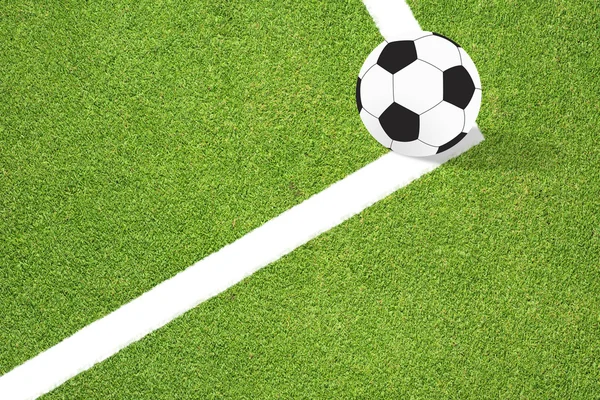 Футбол на зеленом фоне — стоковое фото