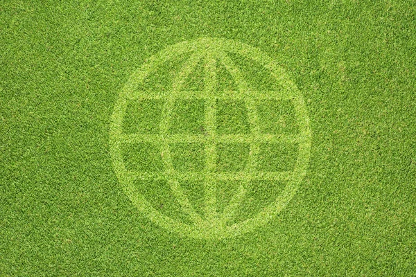 Global icon on green grass background — Stock Photo, Image