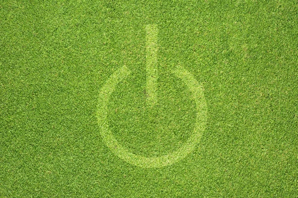 Значок выключения на зеленом фоне травы — стоковое фото