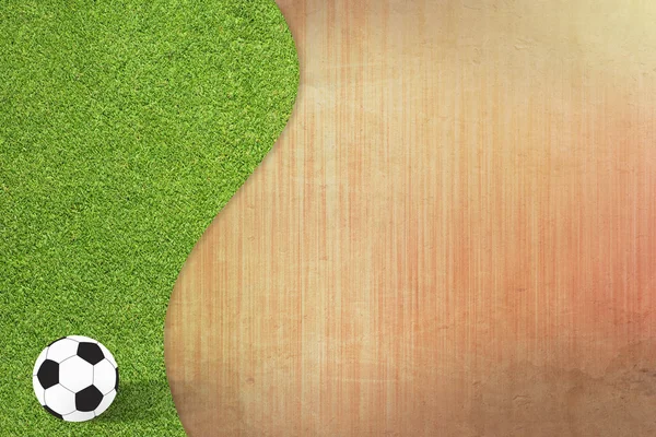 Футбол на зеленом фоне травы и бумаги — стоковое фото