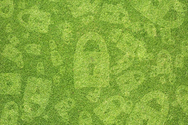 Key icon on green grass background — Stock Photo, Image