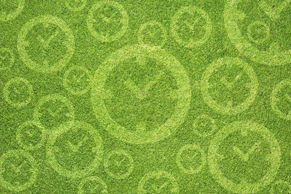 Ikona hodin na zelené trávě textury a pozadí — Stock fotografie