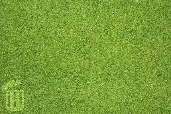 Papperskorgen på grönt gräs textur och bakgrund — Stockfoto