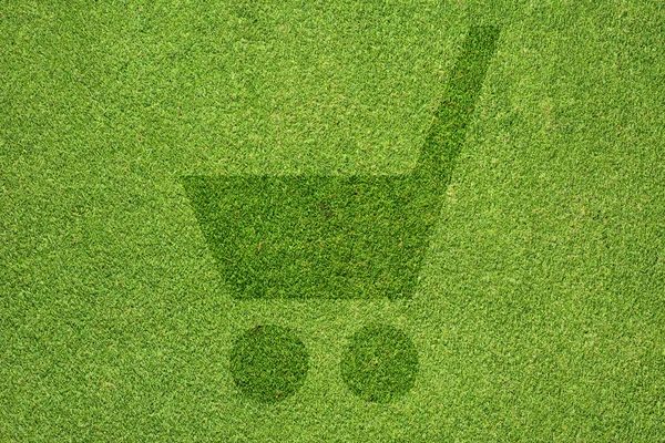 Значок рынка на зеленой текстуре травы и фоне — стоковое фото