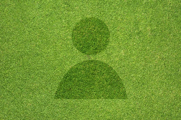 Ícone de homem na textura de grama verde e fundo — Fotografia de Stock