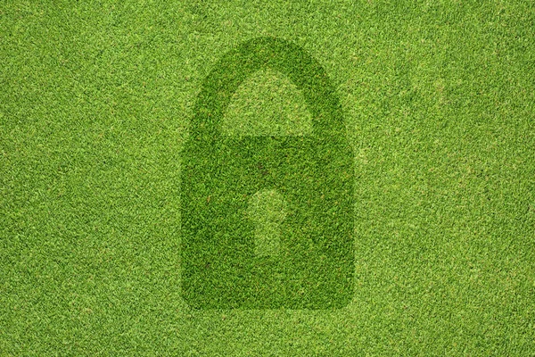 緑の草のテクスチャと背景に鍵のアイコン — ストック写真