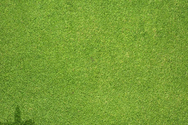 Stad icoon op groen gras textuur en achtergrond — Stockfoto