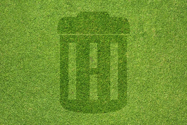 Trash-Symbol auf grünem Gras Textur und Hintergrund — Stockfoto