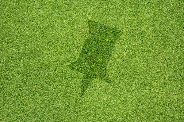 Pin icon on green grass texture and background — Stock Photo, Image