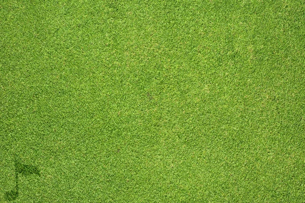 Ícone de música na textura de grama verde e fundo — Fotografia de Stock