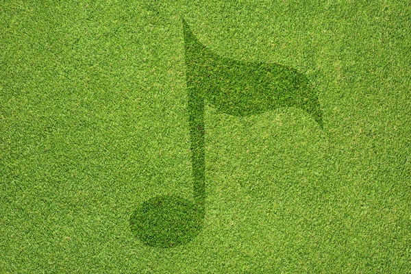 Εικονίδιο μουσική στην πράσινη χλόη υφή και φόντο — Φωτογραφία Αρχείου