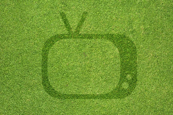 TV-Symbol auf grünem Gras Textur und Hintergrund — Stockfoto