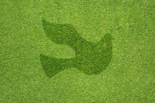 Peace icon on green grass texture and background