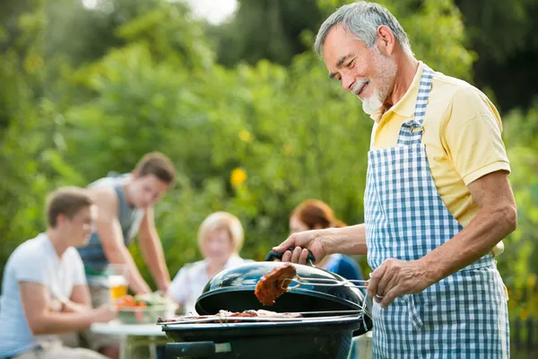 Family having a barbecue party — Stock Photo, Image