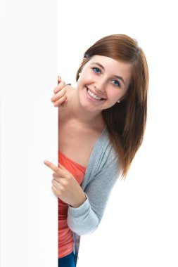 Teenage girl points her finger at a blank board clipart