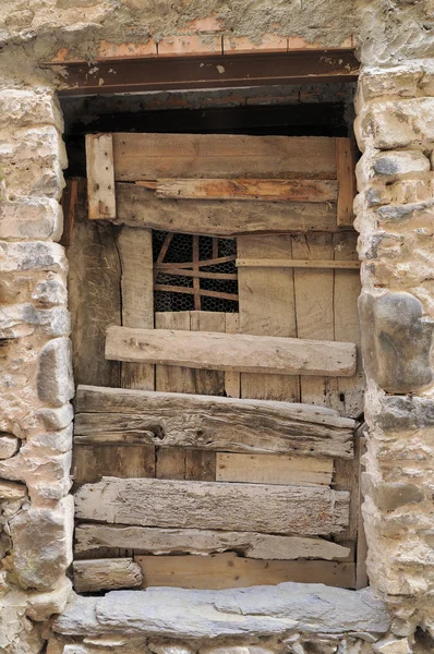 stock image Scruffy wooden door, pigna