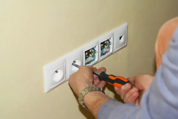 stock image Electrician mounted outlet to 230 volts