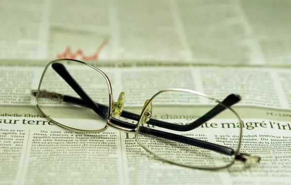 Newspaper and glasses — Stock Photo, Image