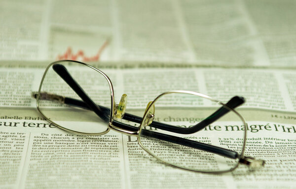 Newspaper and glasses