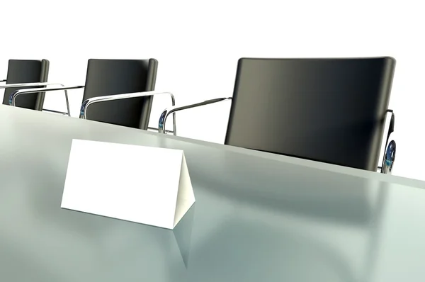 Conference table and empty place card on white background — Stok fotoğraf