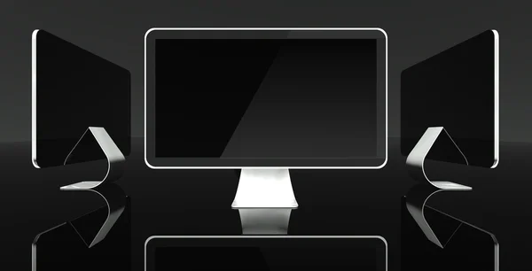 Екрани комп'ютерів стільниці на чорному тлі, простір тексту — стокове фото