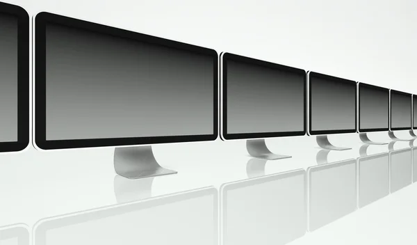 Stationär datorskärmar i rad på vit bakgrund, text utrymme — Stockfoto