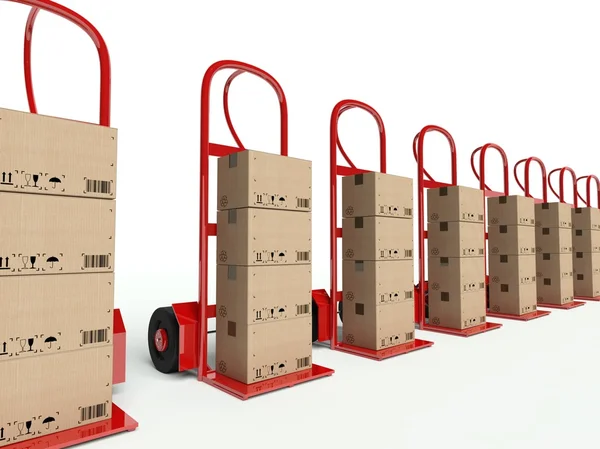 Row of hand trucks with cardboard boxes — Stock Photo, Image
