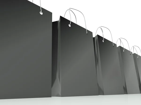 Black shopping bags row, background — Stock Photo, Image