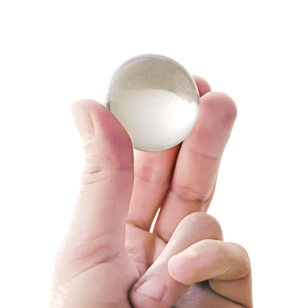 Quartz ball in fingers — Stock Photo, Image