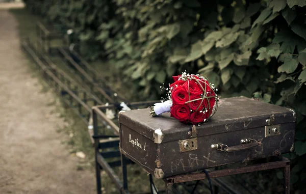 stock image Bridal bouquet on a suitcase