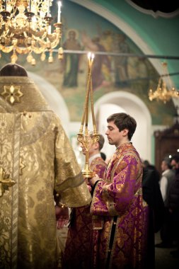 MOSCOW - MARCH 13: Orthodox liturgy with bishop Mercury clipart