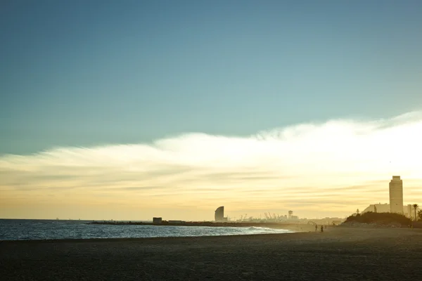 stock image Beach landscape with Barcelona on the background