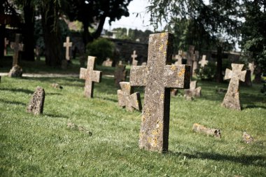 Moldy stone crosses in cemetery clipart