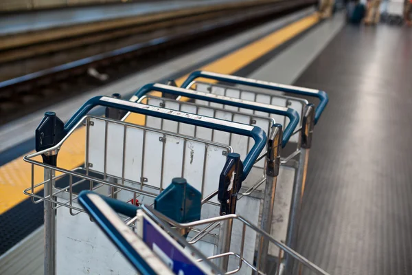 Luggage trolleys in railway station — Stock Photo, Image
