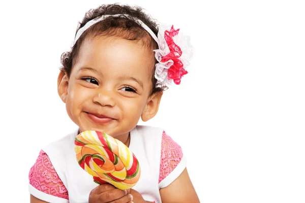 Lovely little girl with a big lollipop — Stock Photo, Image