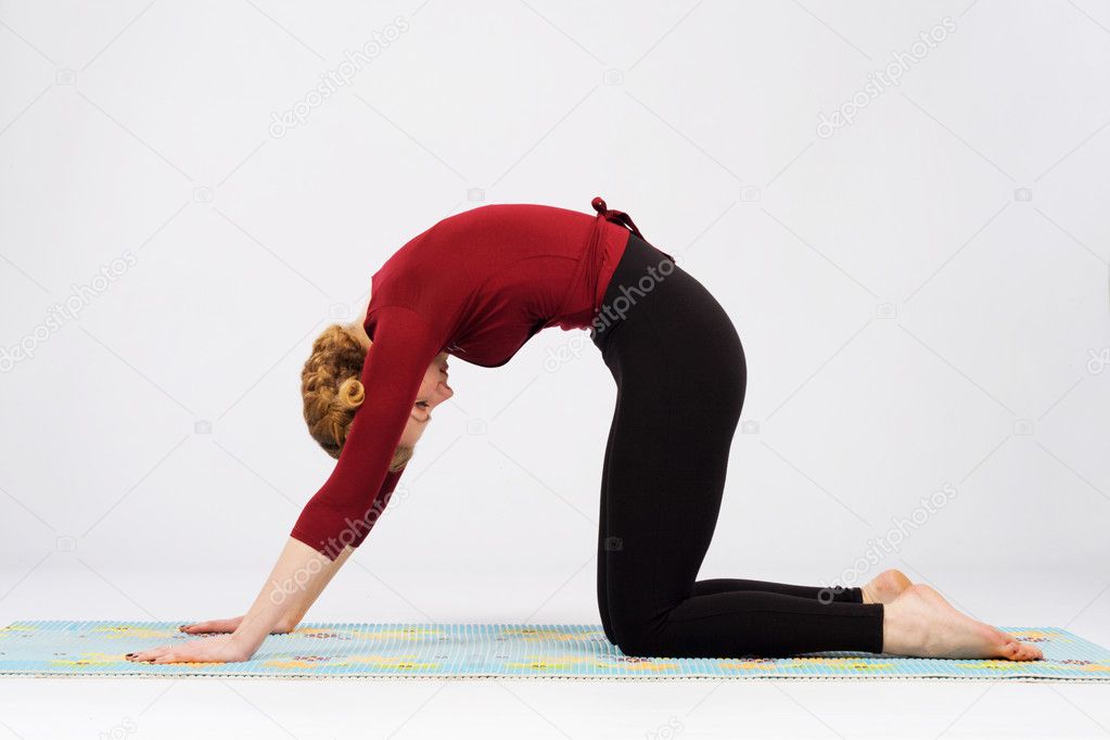 Sporty woman doing stretching exercise outdors