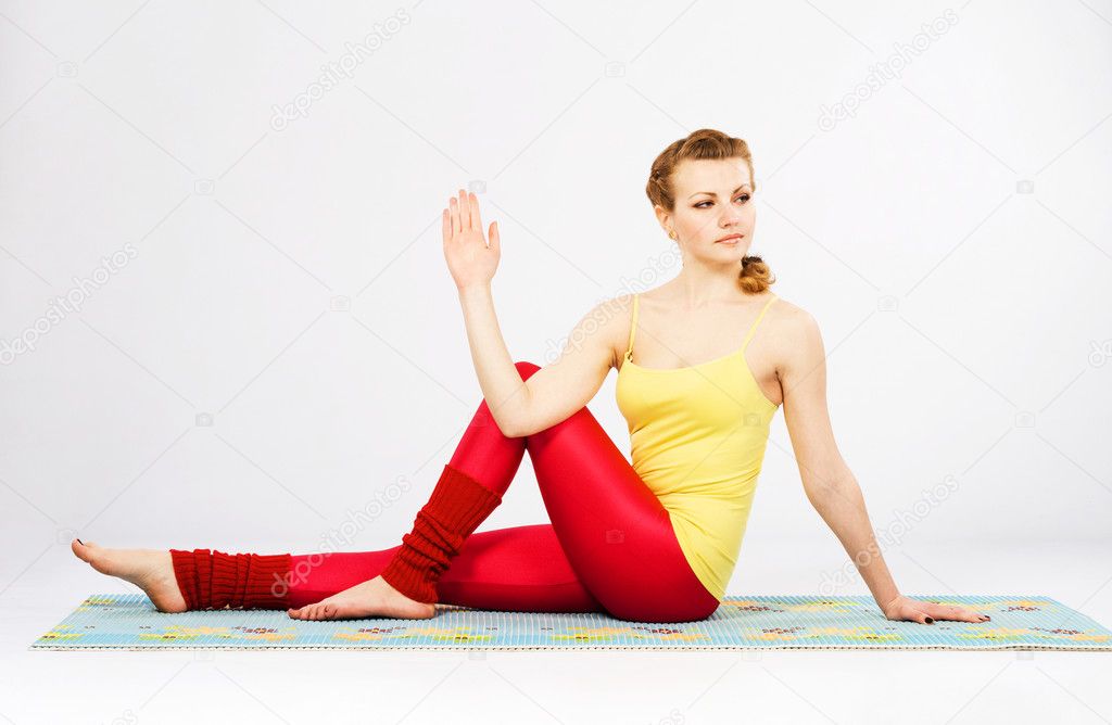 Beautiful woman doing marichi's yoga pose