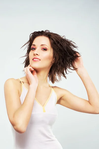 Lovely woman is putting hair her wet hair Stock Image