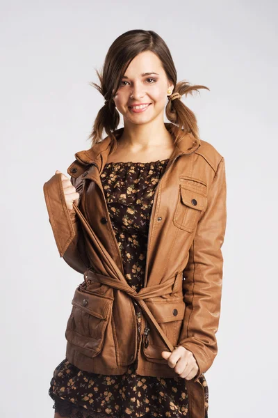 Cute young woman wearing leather jacket — Stock Photo, Image